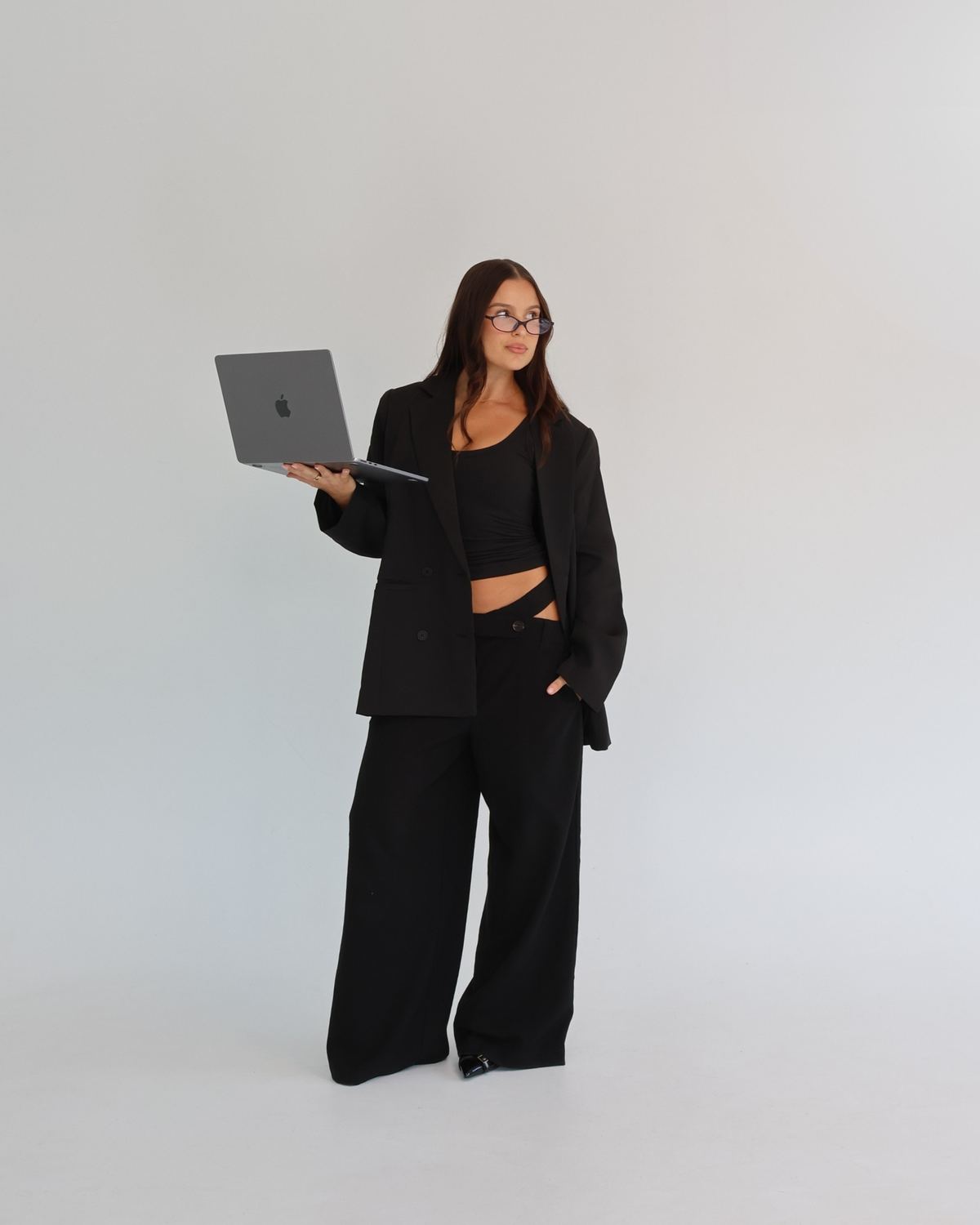G holding a laptop